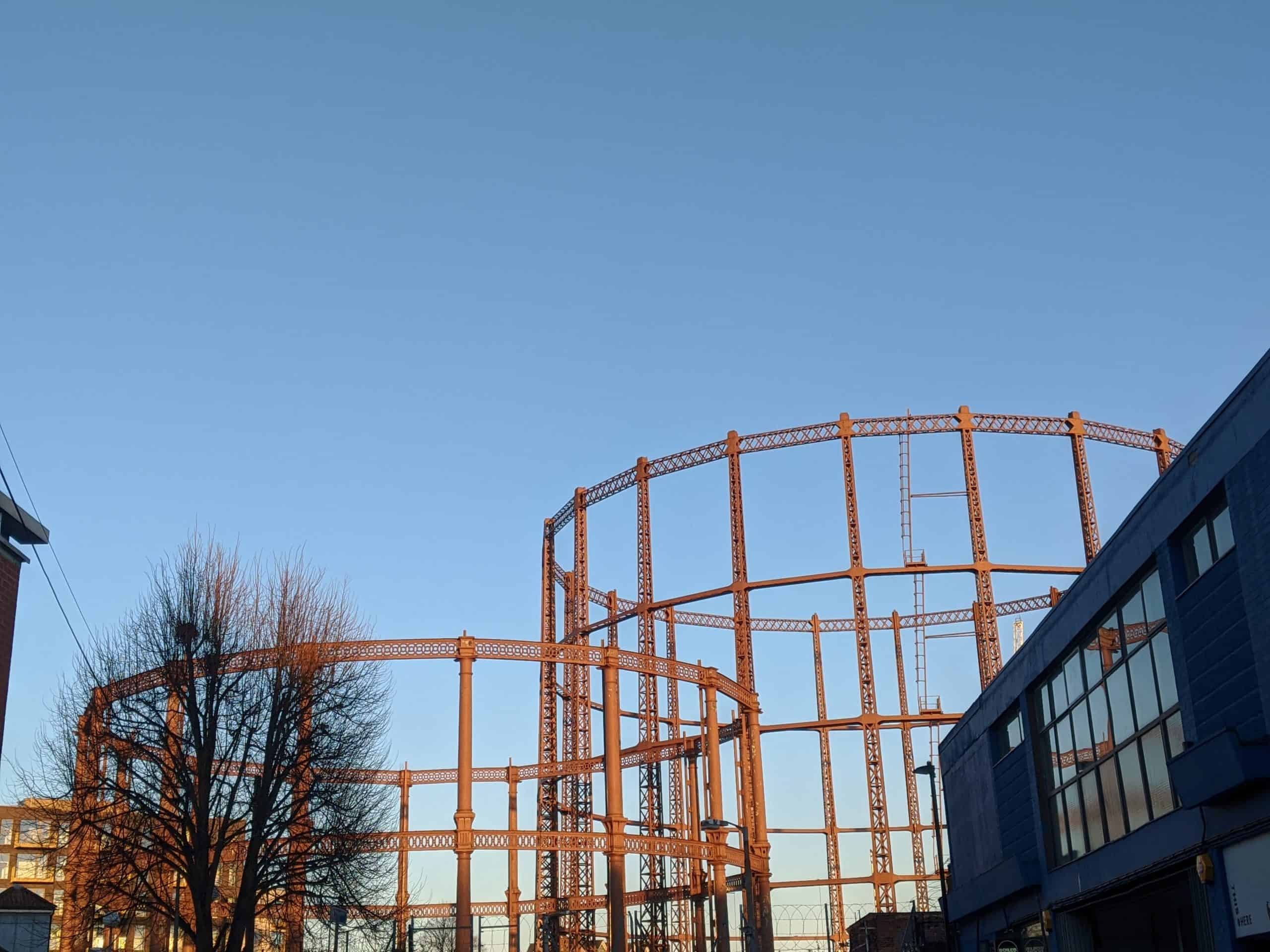 Hackney gas cylinder in front of a bright blue sky