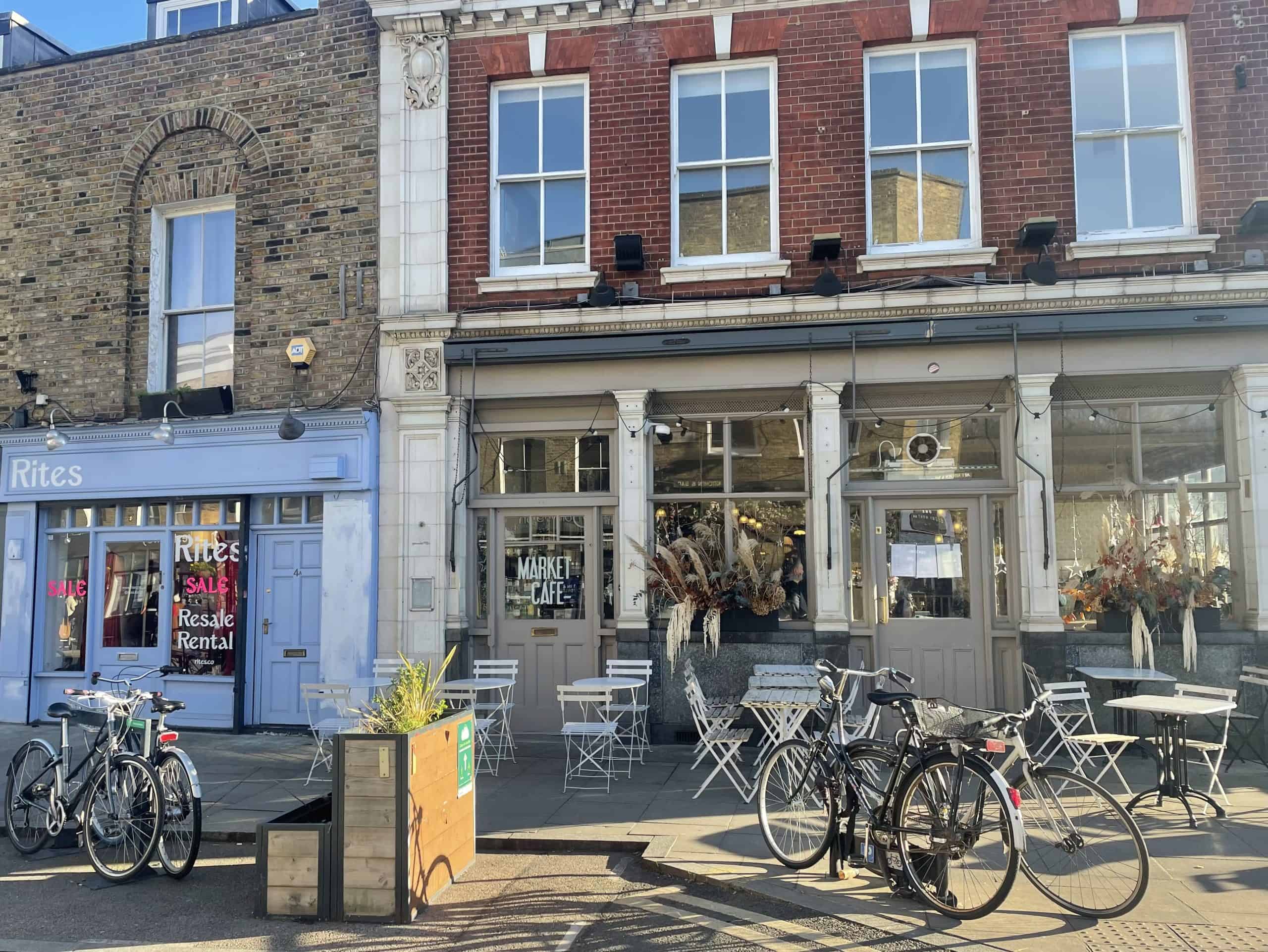 A romantic street in London, lined with cafes and bicycles